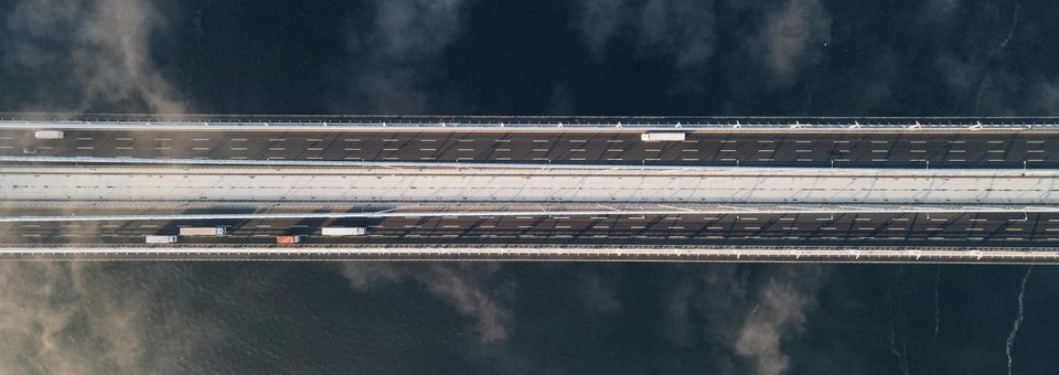 Aerial view of a coastal highway crossing open water